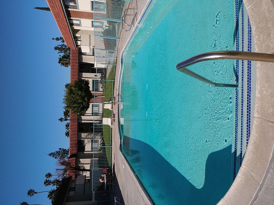 Inviting swimng pool and sun deck at Magnolia Apartments in Riverside, California.