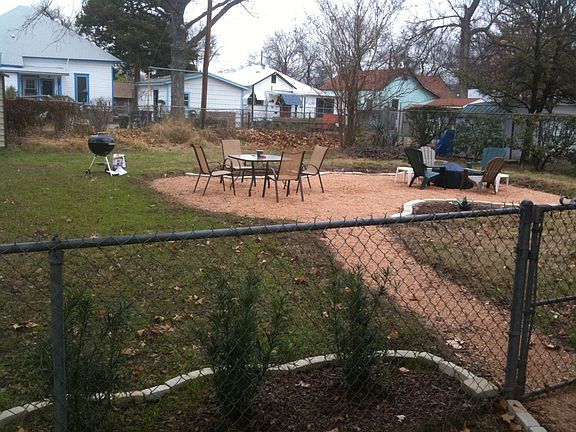Huge fenced in yard perfect for barbecues, having a dog