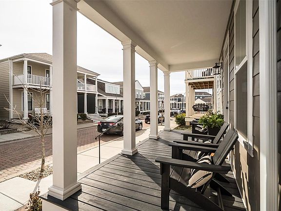 Sit a spell on the front porch and enjoy the quaint Cobblestone Street!