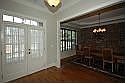 Double Front Doors Open to Warm Entrance Foyer