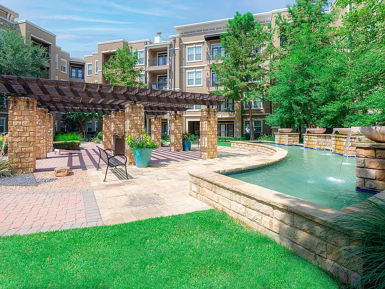 Outdoor seating area near community fountain in Las Colinas