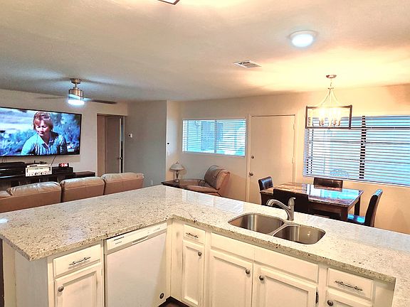 Kitchen provides dishwasher, microwave, and large refrigerator.