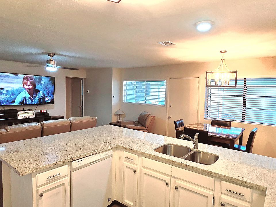 Kitchen provides dishwasher, microwave, and large refrigerator.