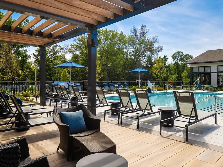 Pool and sundeck with lounge seating