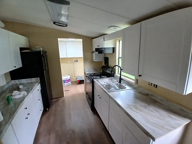 Kitchen with laundry/utility room with washer dryer hook-ups