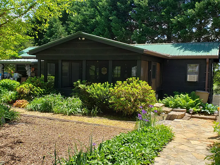 Front view of cabin upon entering property
