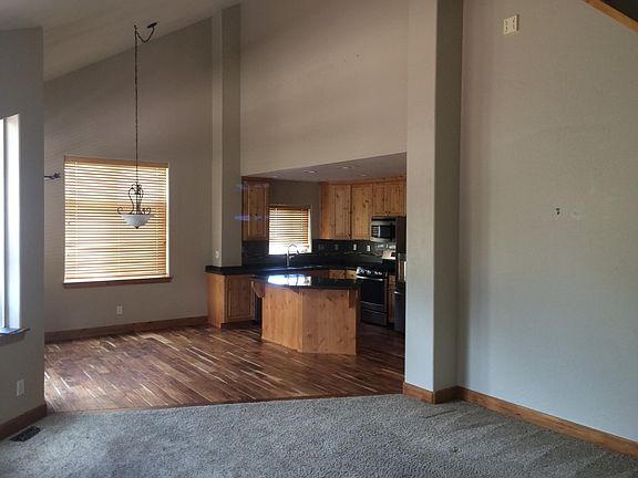 Living room looking back toward kitchen and eating area. Fir