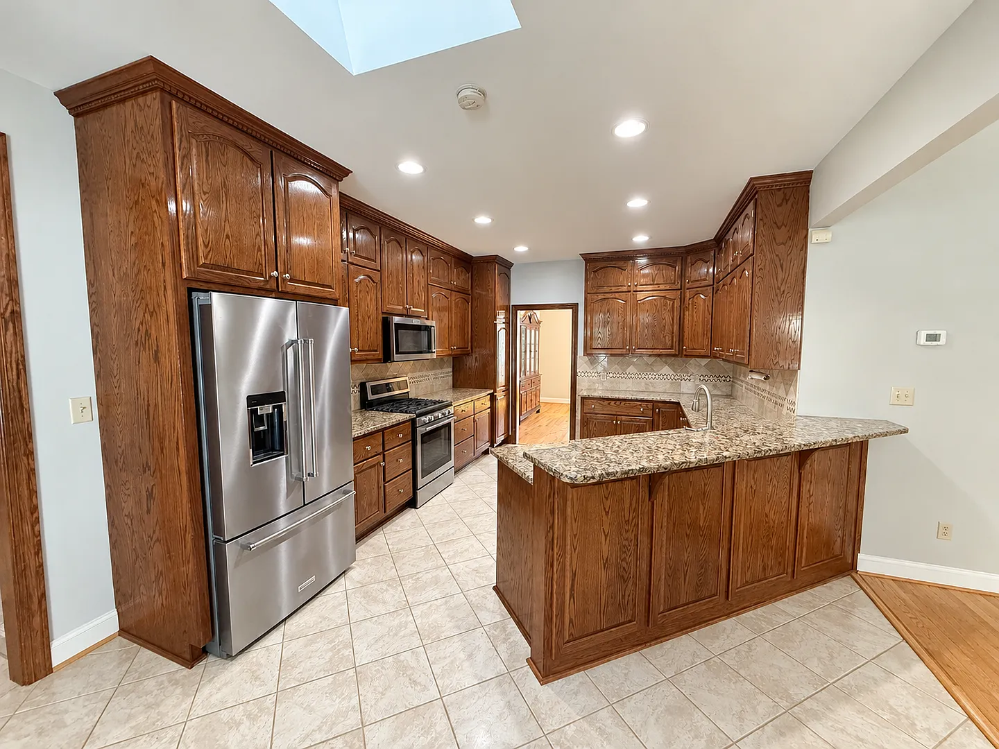 Spacious 7-Bedroom, 4-Bath Home with Finished Basement, Sunroom & Outdoor Kitchen — Photo 3