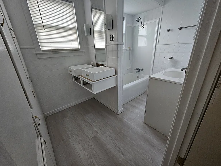 Main bath with loads of cabinets for extra space