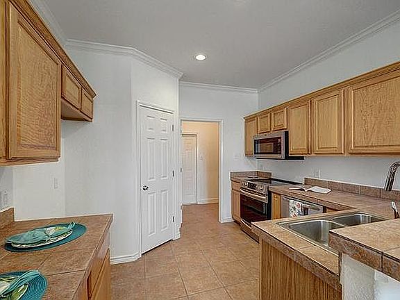 Kitchen, Pantry, Laundry Room, entrance to attached garage