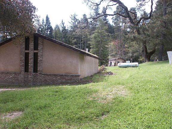 Three Car Garage with Cabin in the distance