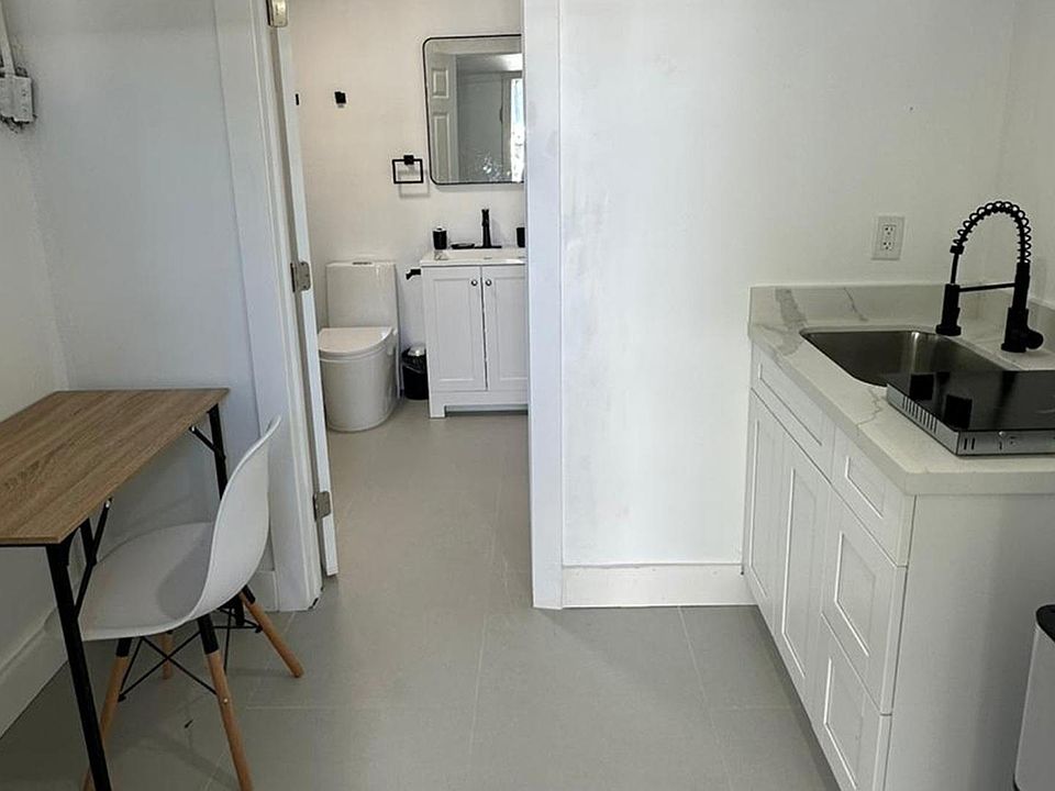 Desk, Stove Sink, bathroom, fridge