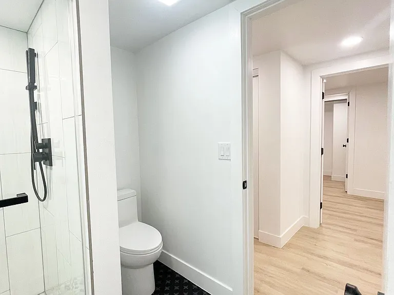 Toilet with outlet behind for bidet attachment