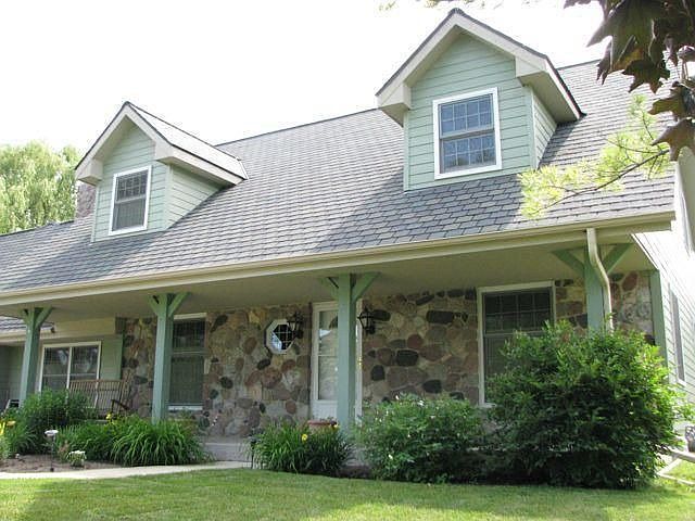 Fiber cement board and stone exterior