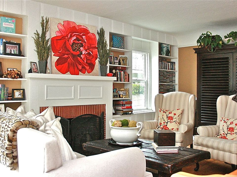 Charming living room with warm fireplace, built-ins and hardwood floors