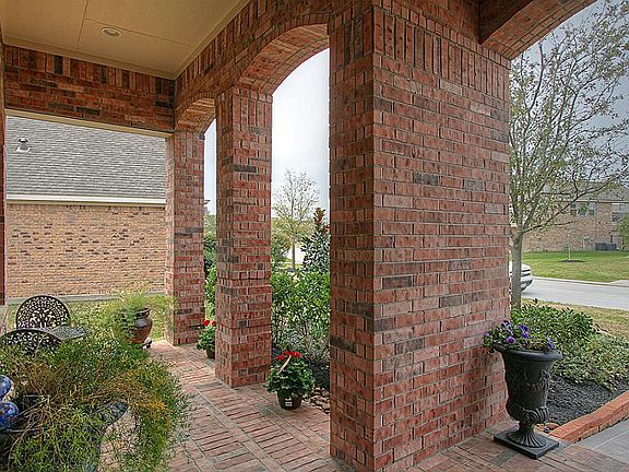 Quaint covered front porch offers and inviting welcome for your guests.