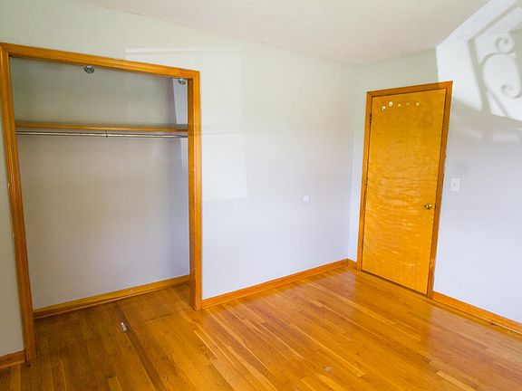 Closet and door to first bedroom