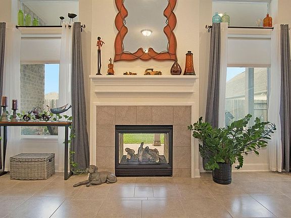 The indoor/outdoor fireplace is such a unique feature of this home!