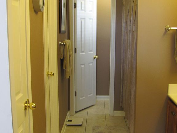 Master bath with jet tub/shower, walk-in closet, and "water" closet at the end