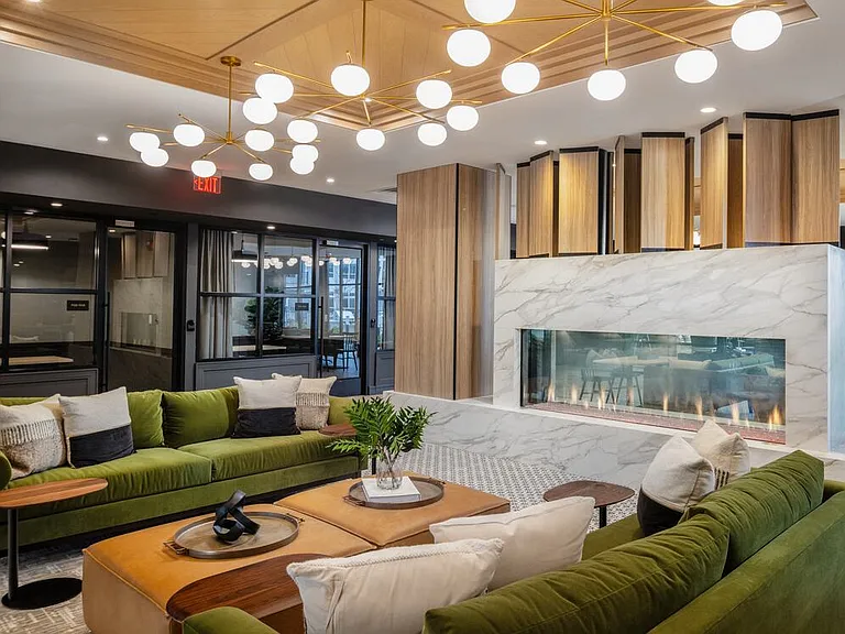 Lobby and leasing area with fireplace and lounge seating