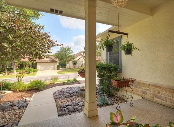 A deep Front Sitting Porch is perfect place to wave at neighbors, while enjoying a favorite beverage.