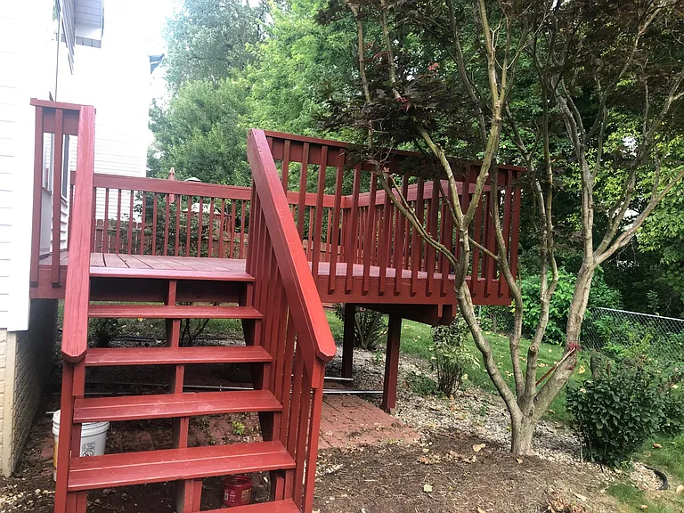 Deck in fenced backyard