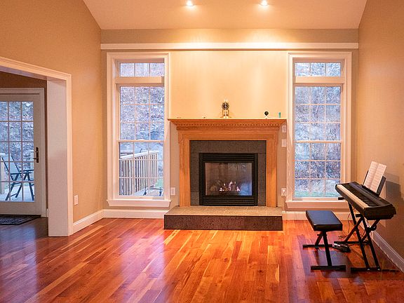 Living room with gas fireplace and beautiful floors