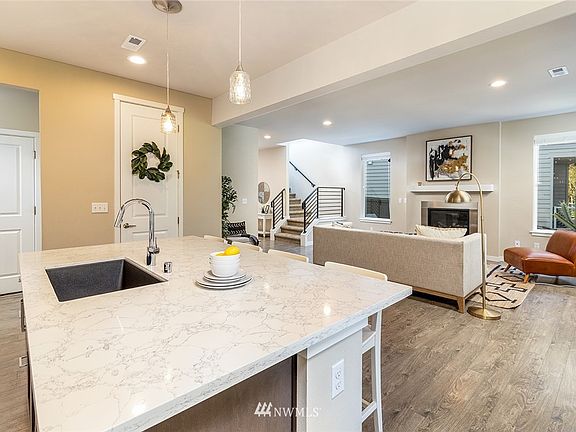 White quartz counter tops with black sink that was customized
