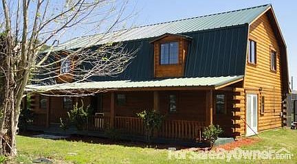 Front View of House
						:
						Authentic log home on 3.3 country acres in central Florida with horse barn, .
