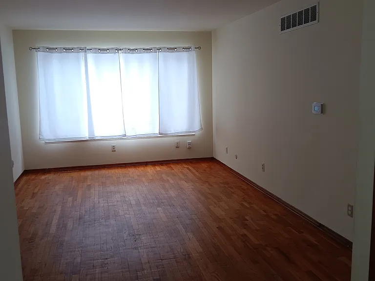 Living area with has large curtained window and full back yard view for kids/Pet monitoring. smoke detector, clean paint.