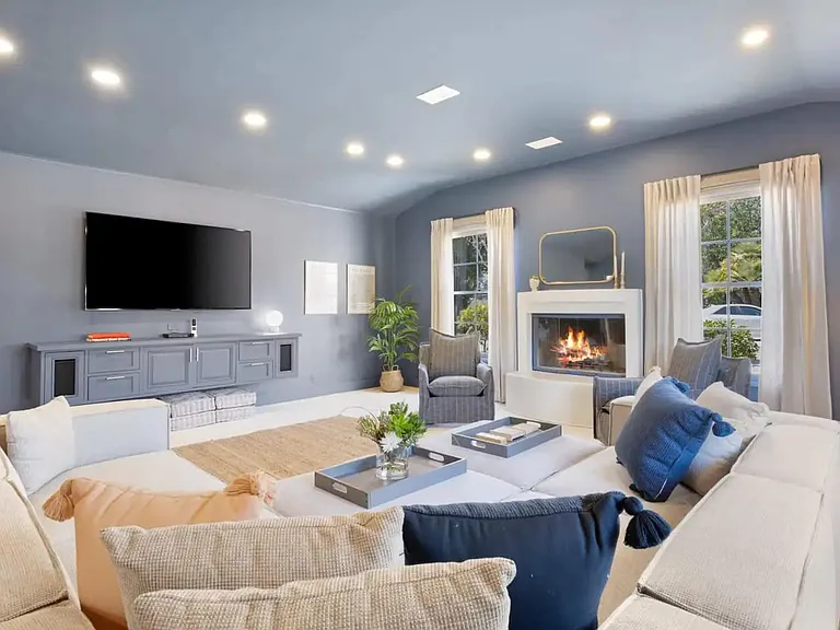 Sit back and get comfortable nect to the fireplace in the spacious living area