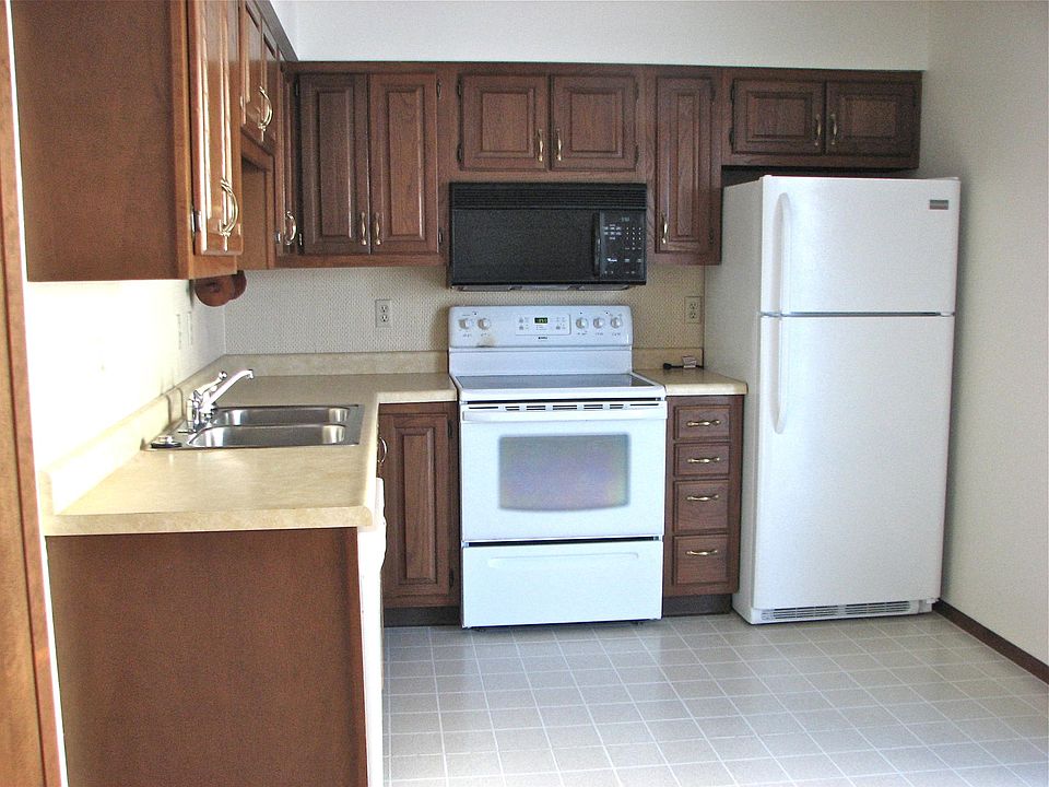 Kitchen equipped with microwave, dishwasher and pantry (left of where cabinets begin)