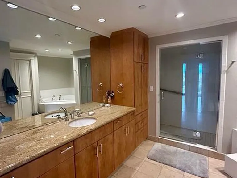 2nd bathroom is a huge master bath with full shower, jacuzzi tub, separate toilet room, linen closet and storage galore.