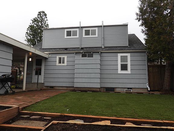 Back of house; new landscaping, raised beds