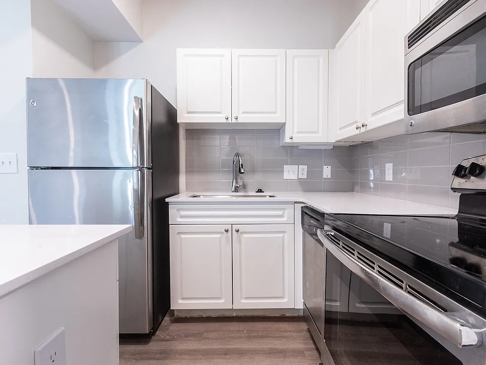 Renovated kitchens include stainless steel appliances and quartz countertops