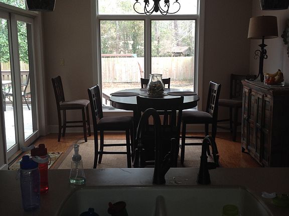 dining room looking over fenced backyard