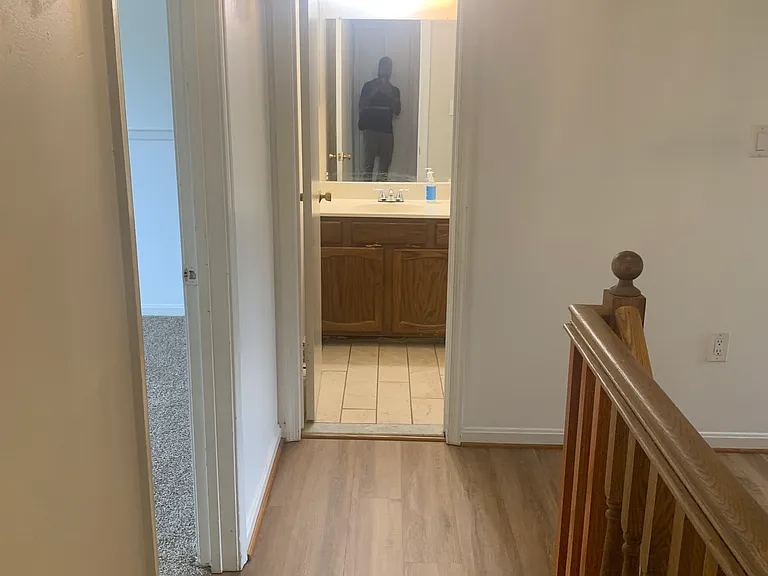 Hallway view into Full Bathroom