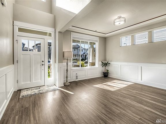 Entrance and formal dining offer stunning touches. Not visible in the picture is the lighting in the coffered ceiling and the Juliet balcony above the door. 