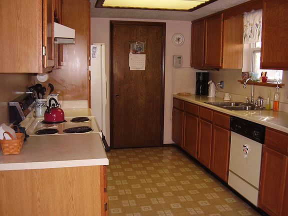 Updated, step-saver kitchen with built-in pantry, roll-out shelves