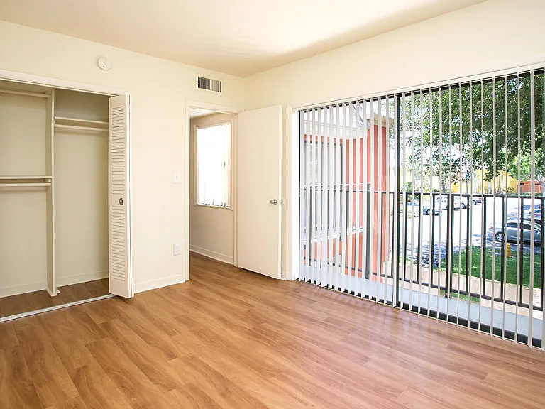 Spacious bedroom with balcony access