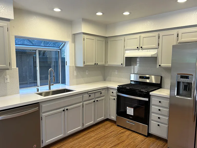 Kitchen with newer quartz countertop