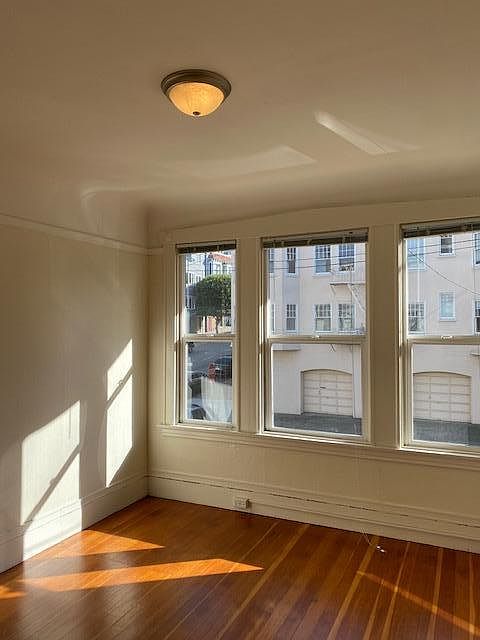 Front Room- Corner of Gough and Filbert. Light with hardwood floors. This room used as front room or bedroom.