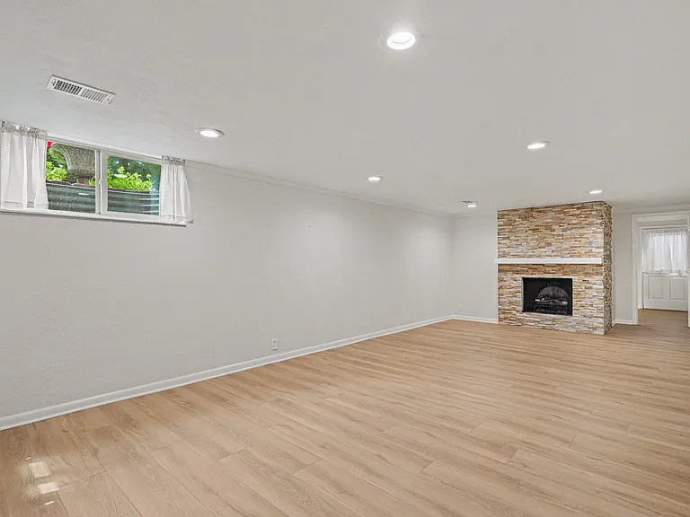 Lower level living room with fireplace