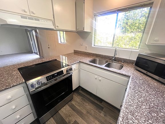 Kitchen with plenty of storage and sleek counter tops