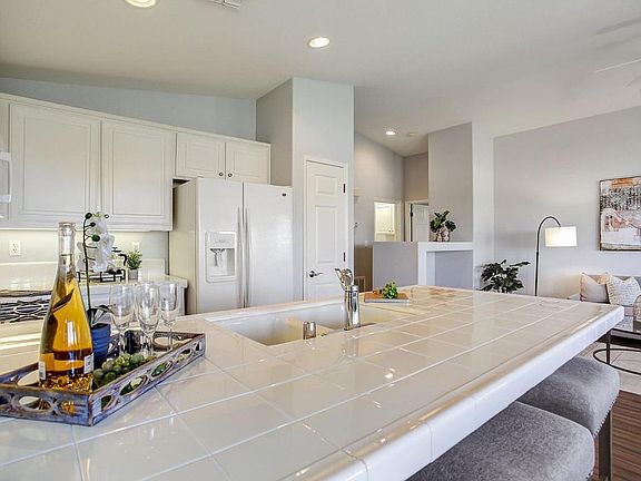 Kitchen with refrigerator, stove/oven, microwave, dishwasher, garbage disposal