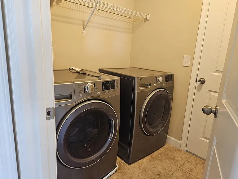 Washer and Dryer room - adjacent to Master bath room and second floor walk way.