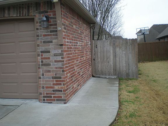 Concrete walkway to backyard