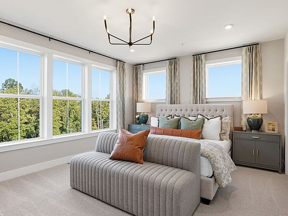 The primary bedroom of the Scarlet by Brookfield Residential.