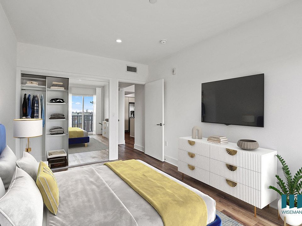 Bedroom with Mirrored Closet with Shelving