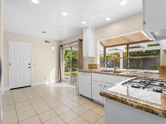Incredible kitchen with picturesque windowbox to the back yard.